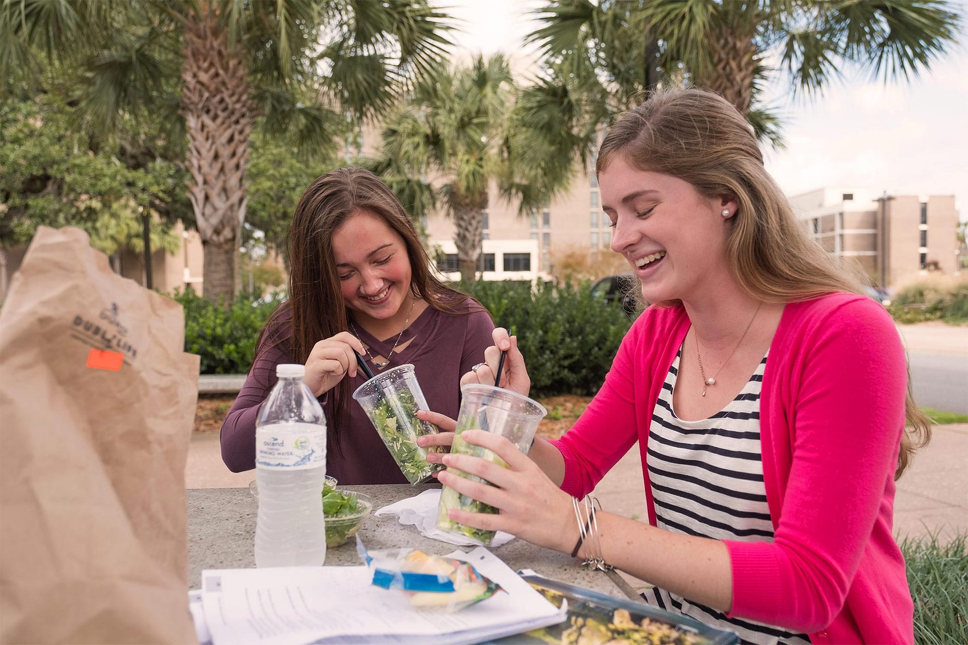 Girls eating outside.