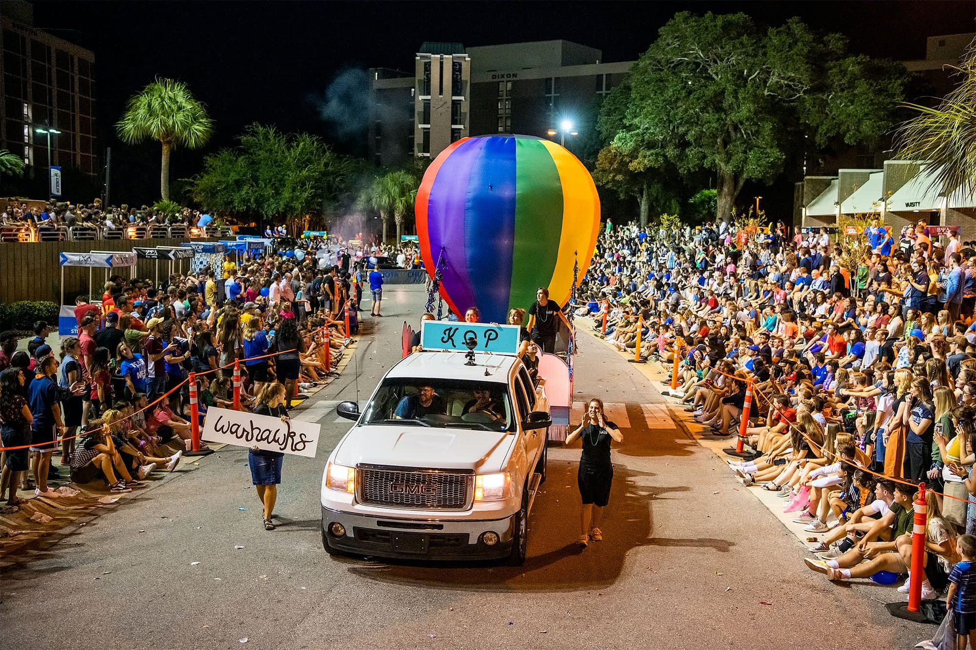 The Warhawks float goes down Main Drive with a hot air balloon attached