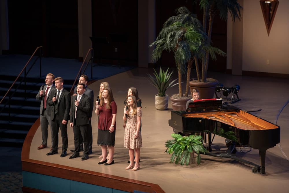 Group sings during a service at Bible Conference