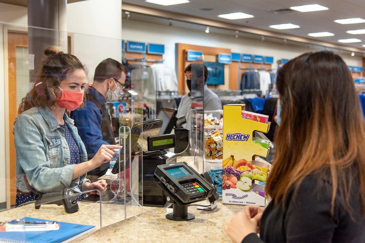 Girl buying something at the Campus Store