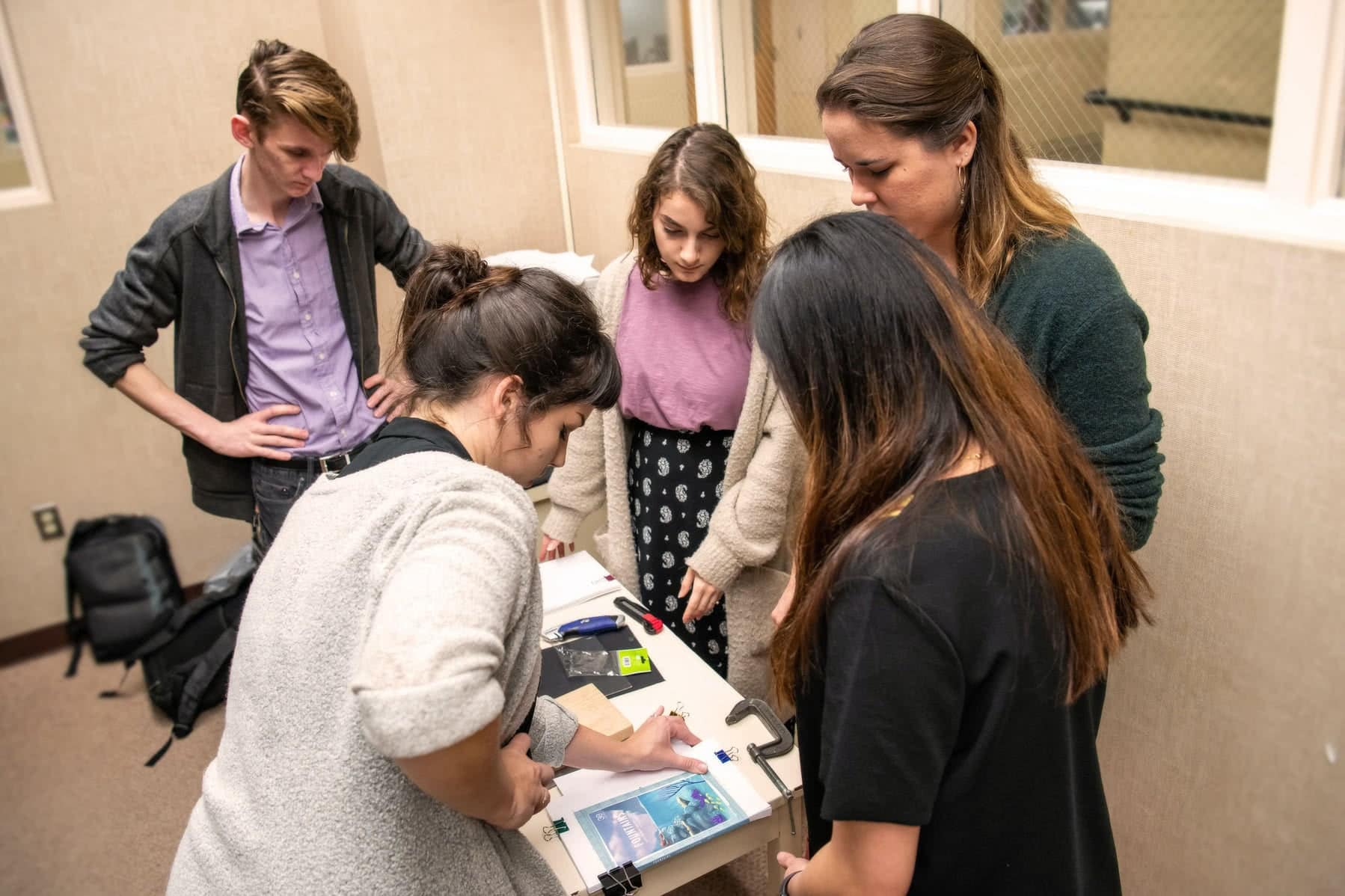 A group of students working together at a table.