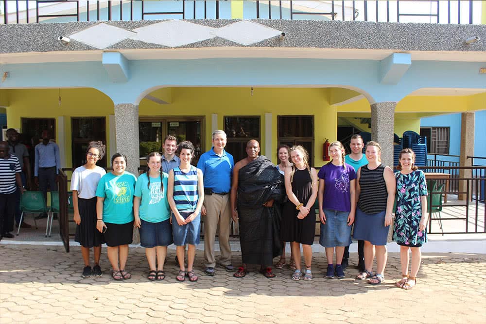 YOM missions team taking a photo with a local. 