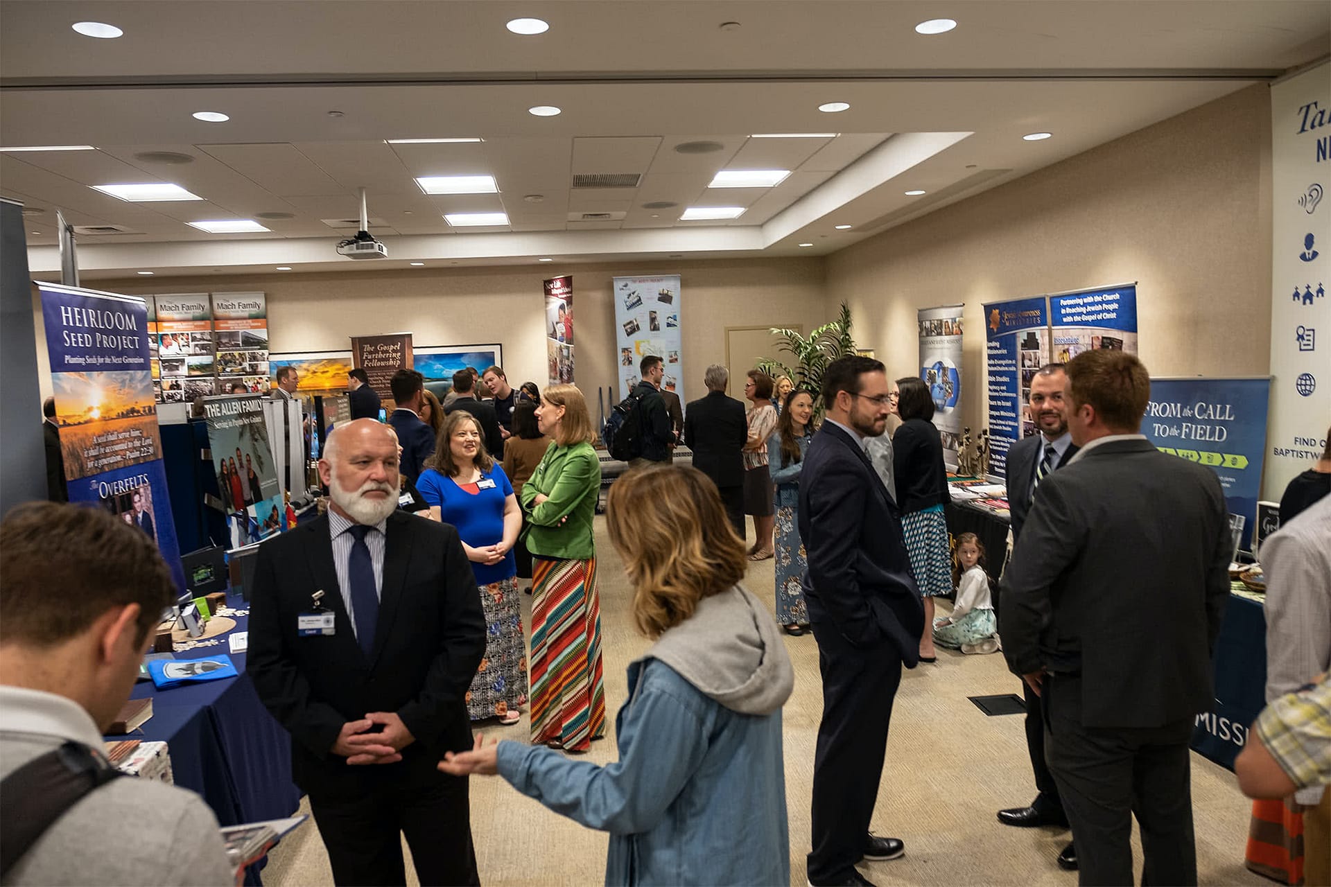 Missionaries speaking at their displays.