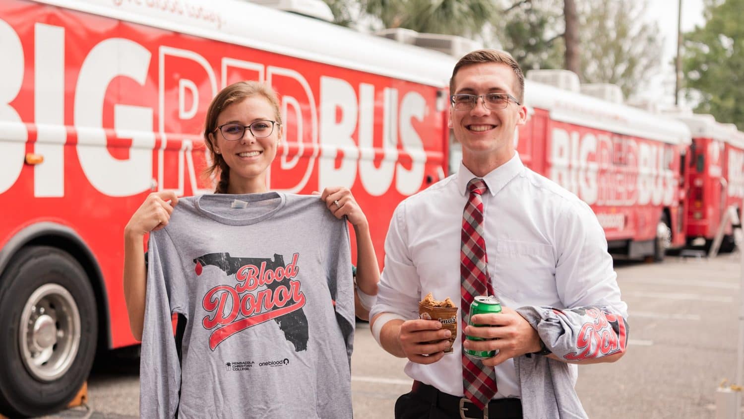 male-and-female-student-holding-shirts Male and female student holding t-shirts