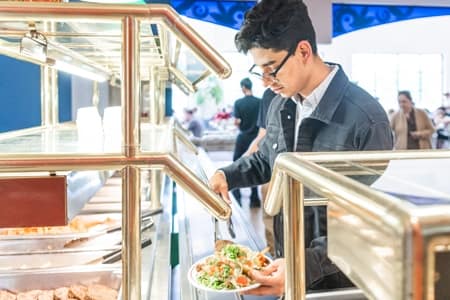 Student getting food at Four Winds