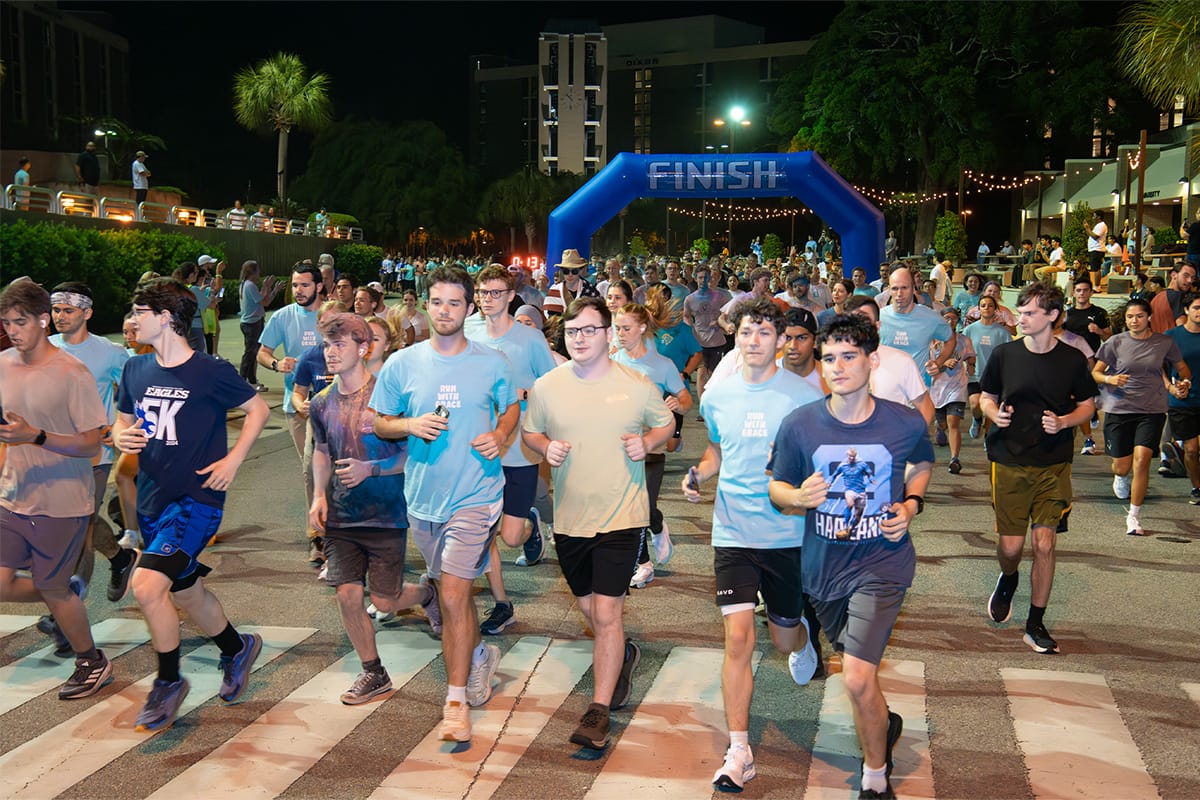 Students running at the start of the race