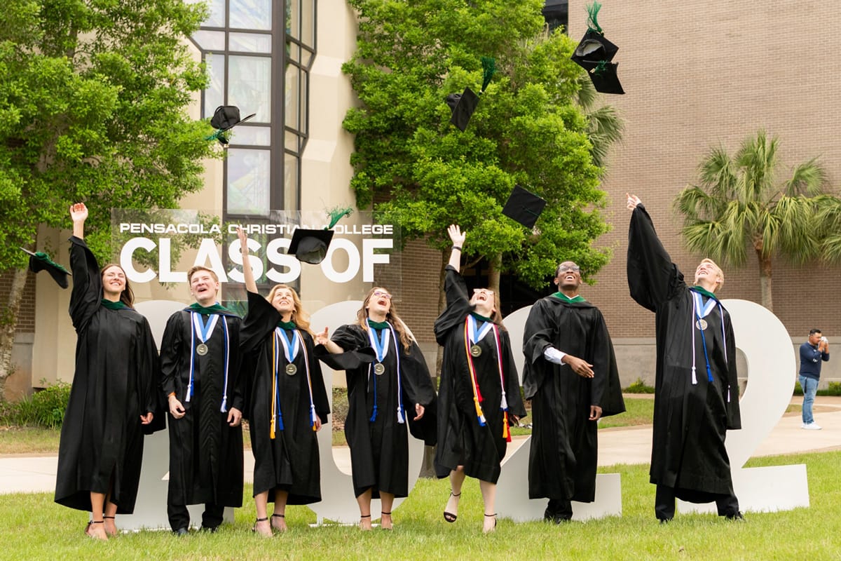 art-sci-commencement1 PCC Graduates toss their hats after PCC Commencement ceremony.