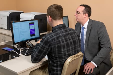 Dr. Sparks works with a student.