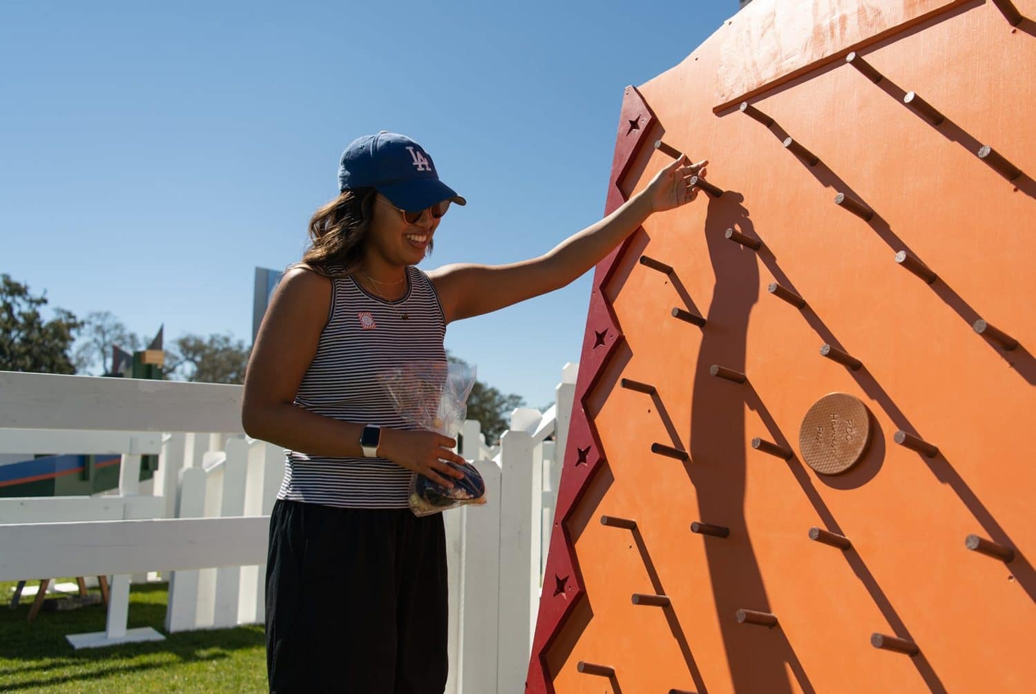 Girl plays plinko at PCC's Bible Conference Picnic