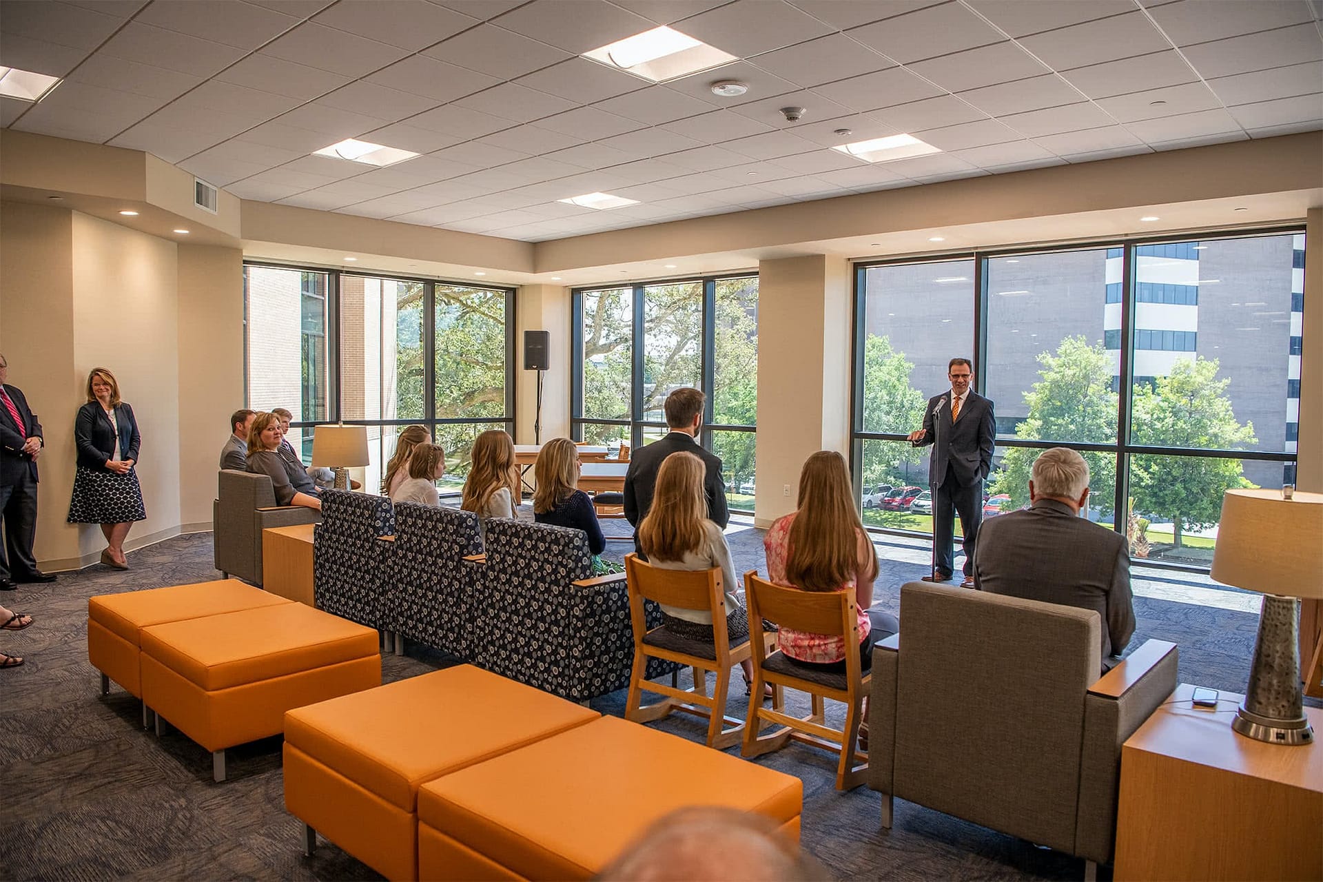 People sitting and listening to Pastor Jeff Redlin speak at the Rice Tower Dedication. 