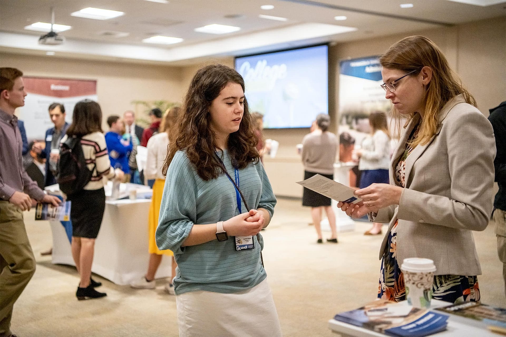 A student talking to a PCC faculty member.