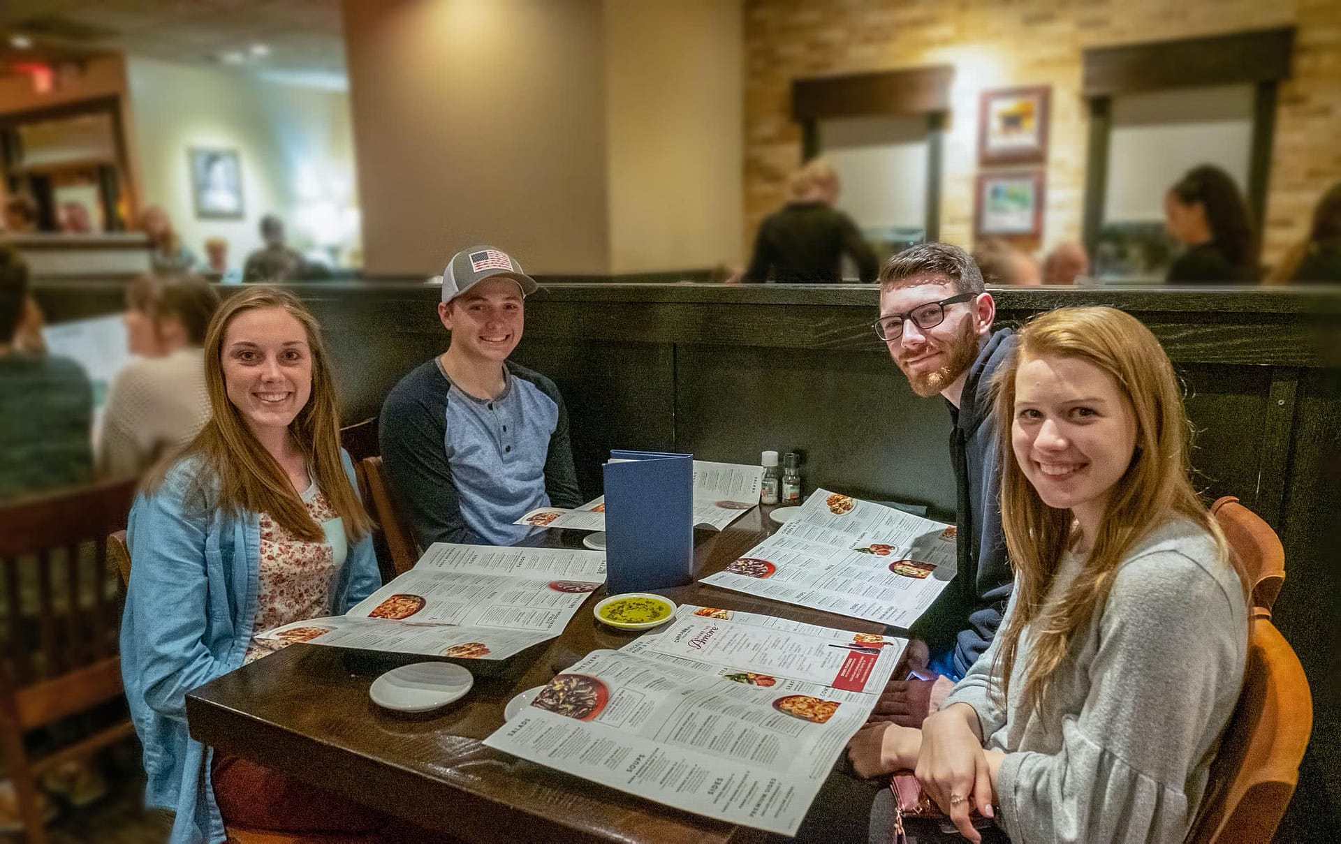 Four students eating together at Carabbas.