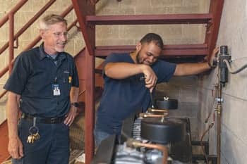 Maintenance foreman Dave Wass with a fellow PCC staff employee.