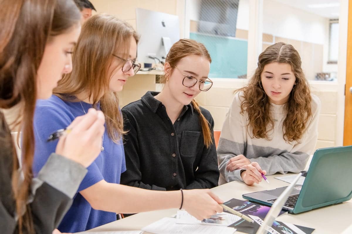 fountains-peer-review PCC students work together in class to design the cover of the 2024 Fountains Publication