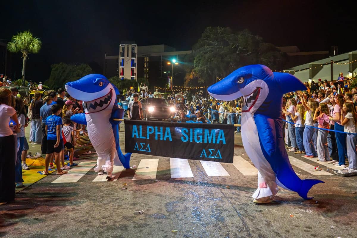 nr-greek-rush-sharks PCC Students dress up in shark costumes to showcase their collegian in the Greek Rush Parade at PCC's 2026 Greek Rush Event