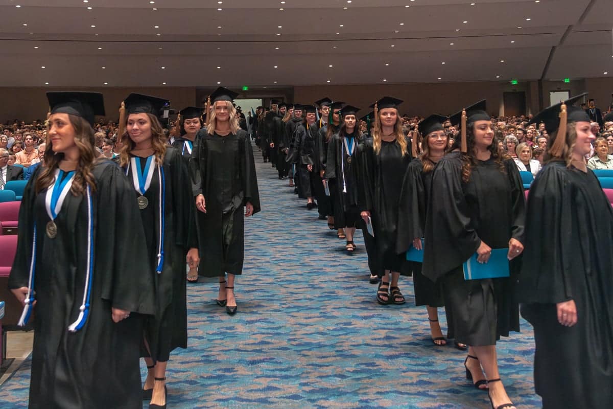 profstu-walk 2024 Graduates walk down the aisle during Commencement