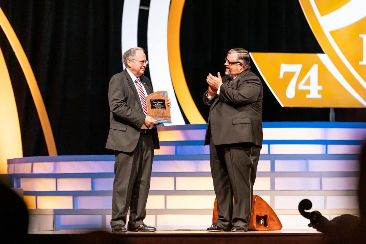 gala50th-hurst Dr. Shoemaker awards a memorative plaque to Mr. John Hurst