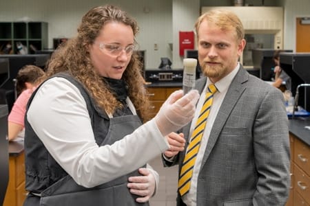 Dr. Sebastian Spencer helping a student