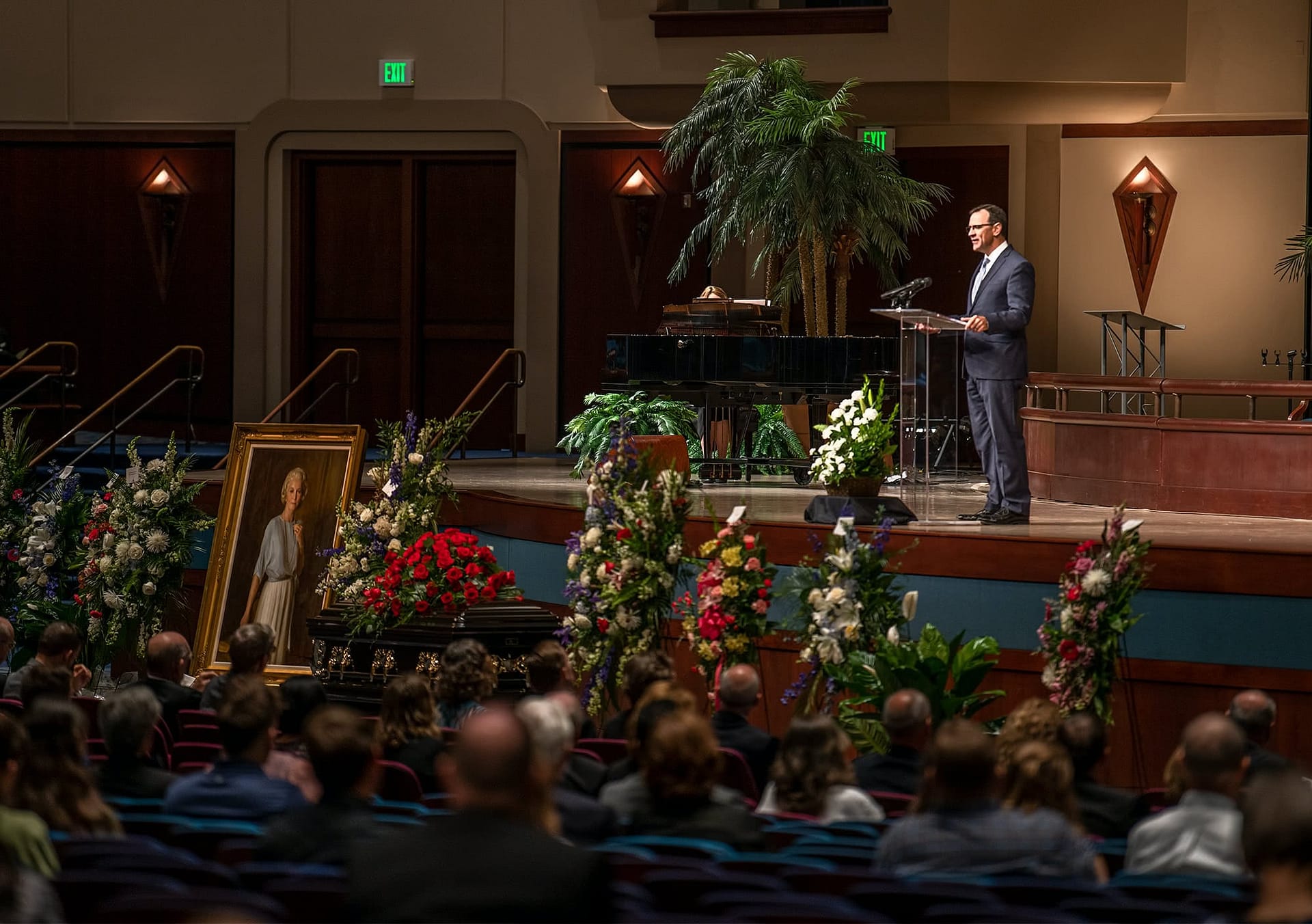 Pastor Redlin speaking on stage at the memorial.