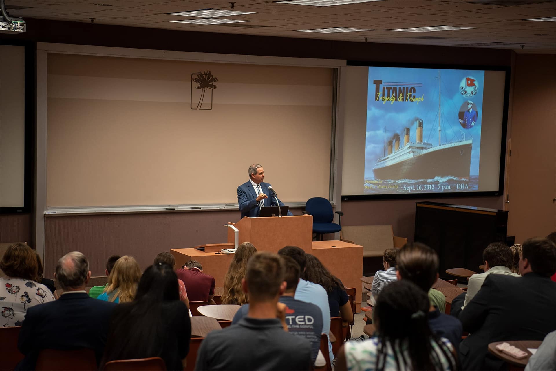 John Reese teaches a seminar about the Titanic