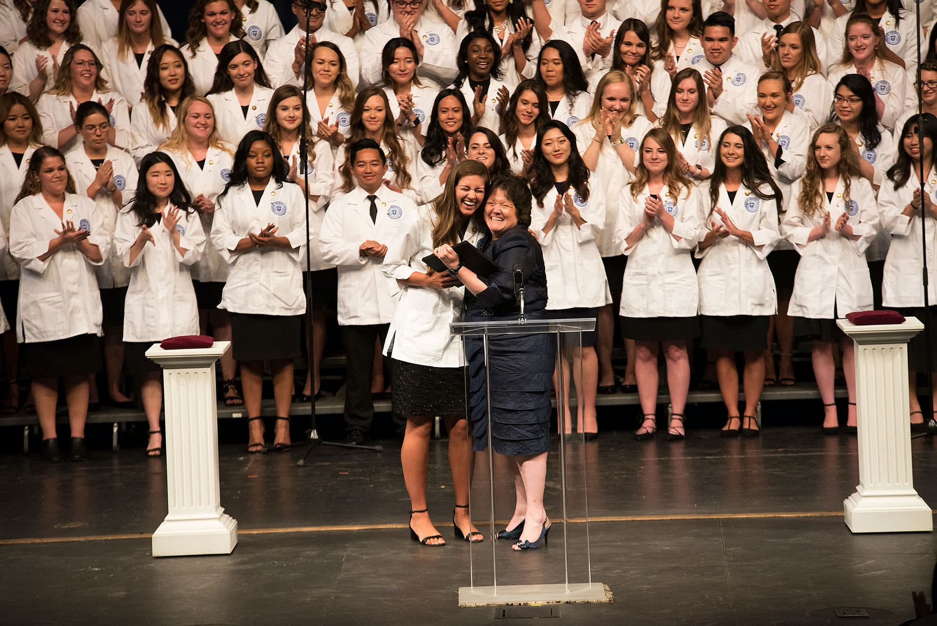 Dr. McCollim awards the top nursing student with an award