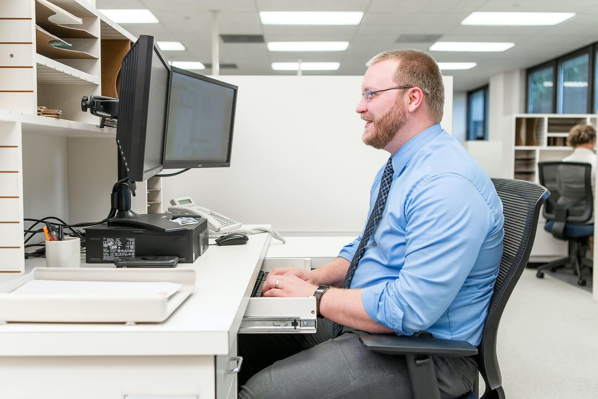IT staff member at his desk.