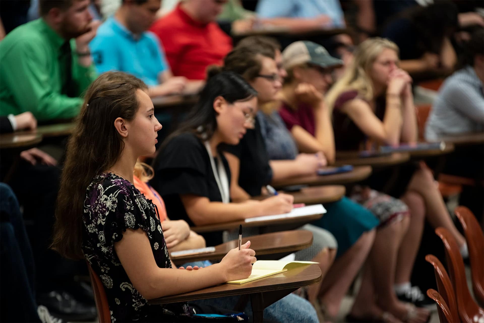 Students take notes during the seminar
