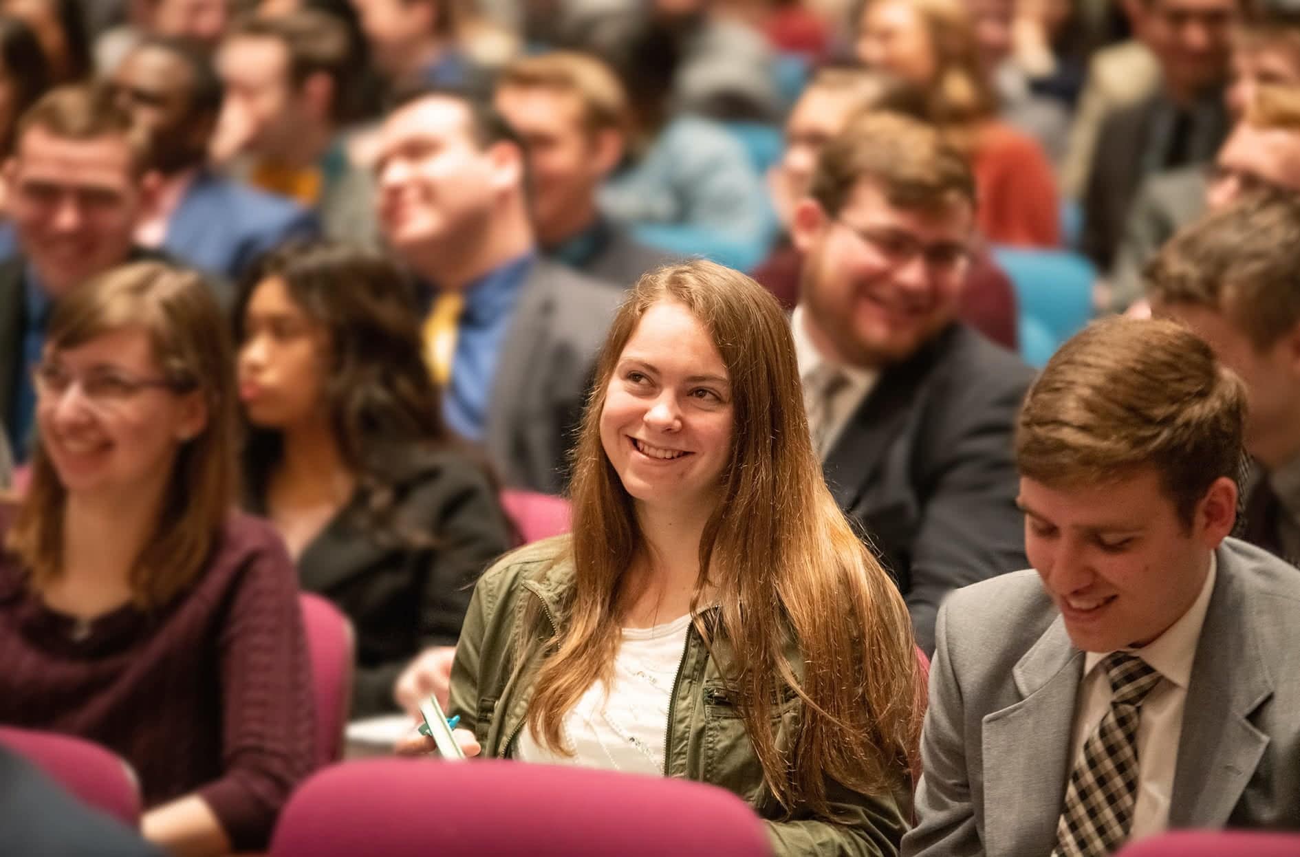 Students laugh at the illustration the preacher gave at Bible Conference