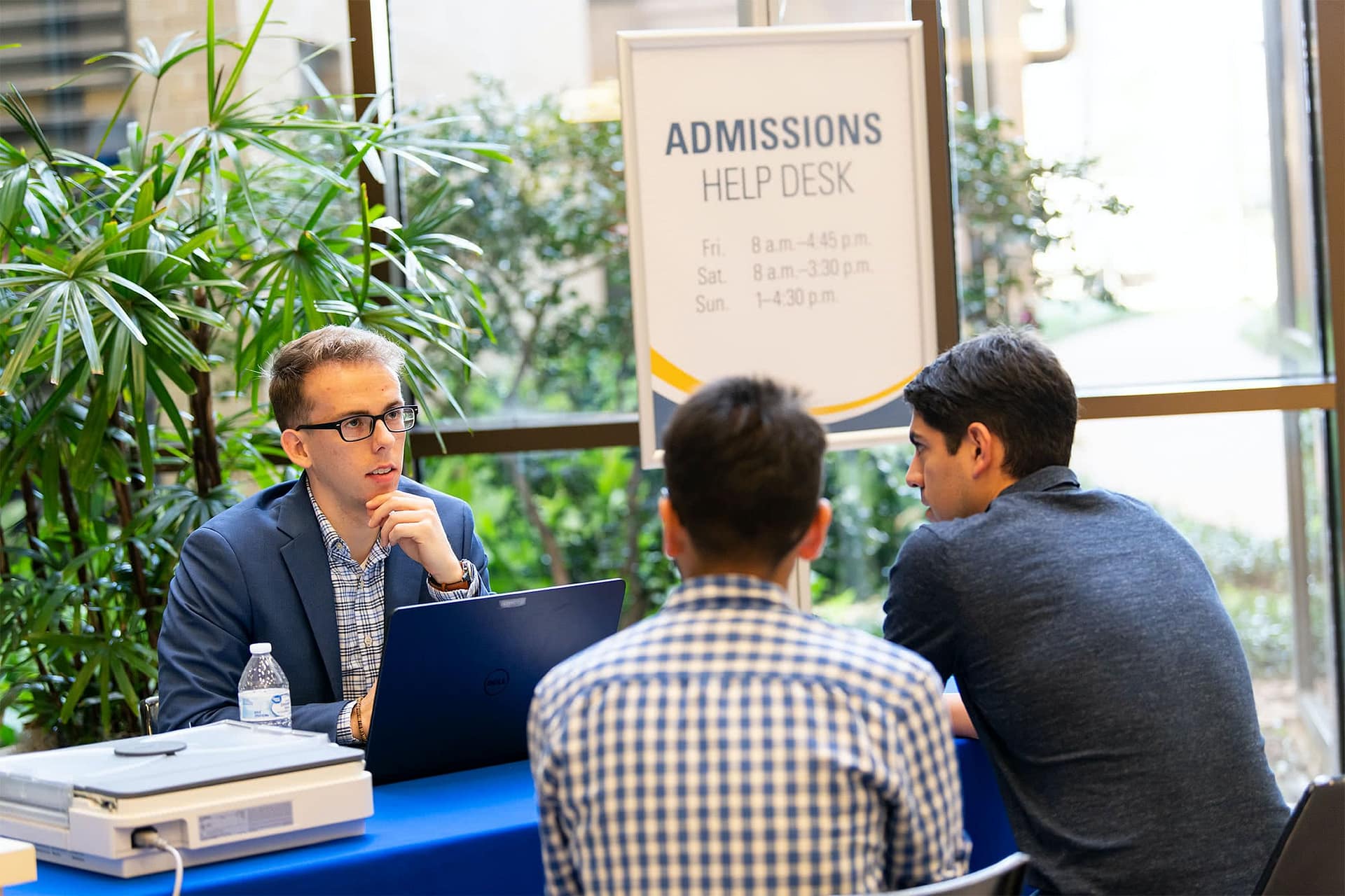 Admissions advisor speaking with new students.