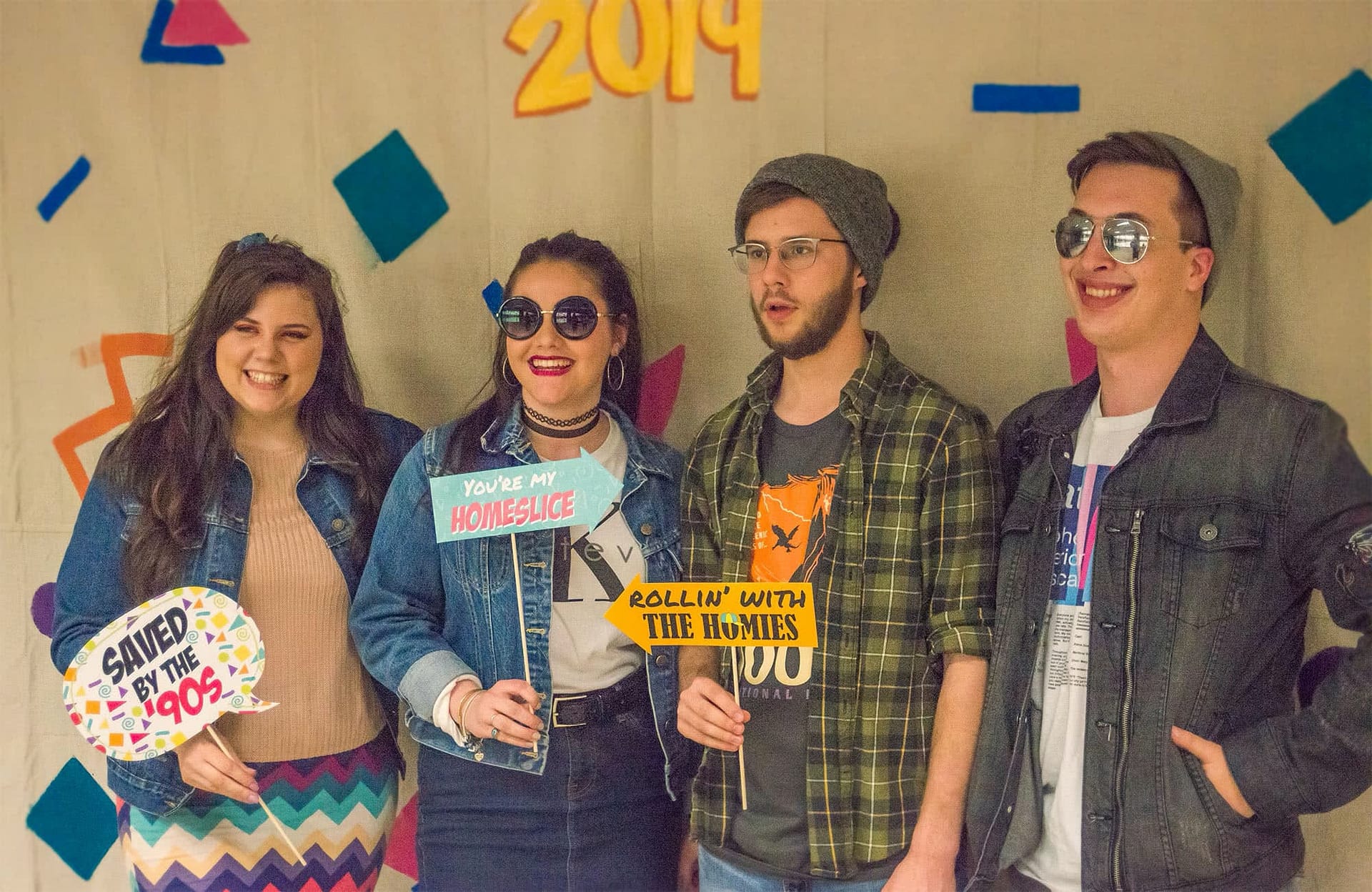Students posing for a photo with props.