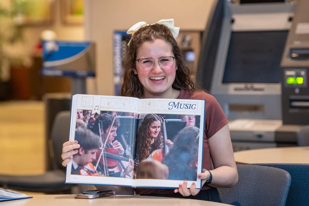 PCC Girl appreciates seeing herself featured on one of the pages from the 2024 Summit Yearbook