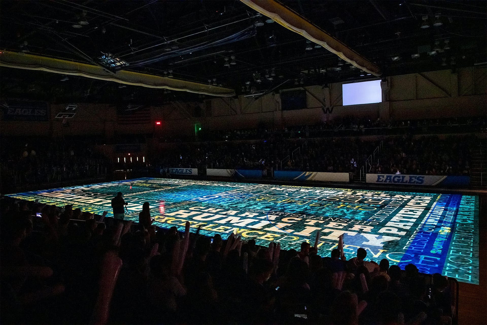 With all the lights out, the floor show projections begin at Eagle Mania.