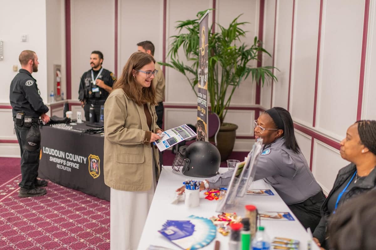 PCC Student visits Employer representative booth at the PCC Career Fair.