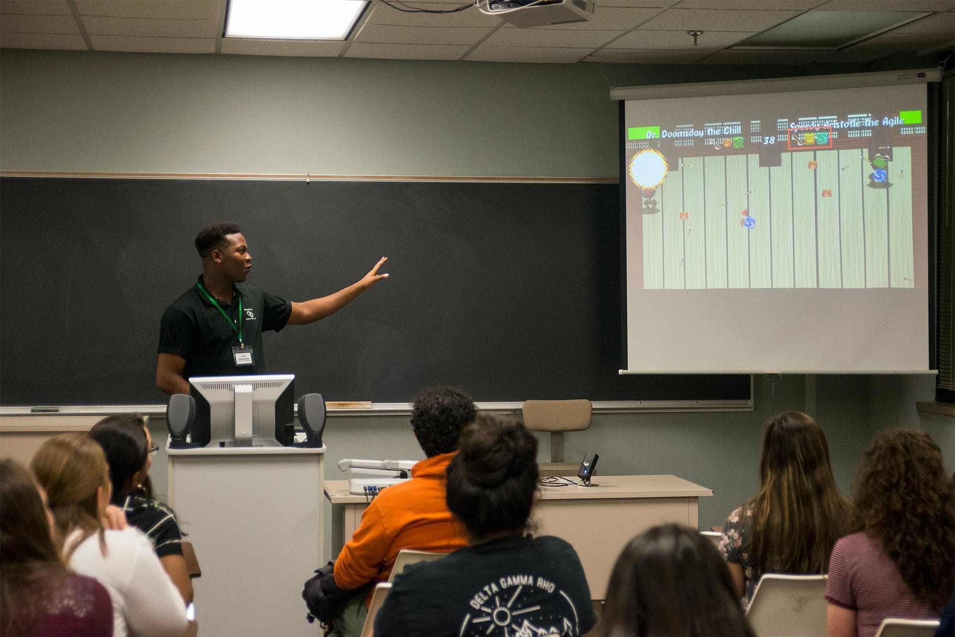 Students watching a software program being projected. 