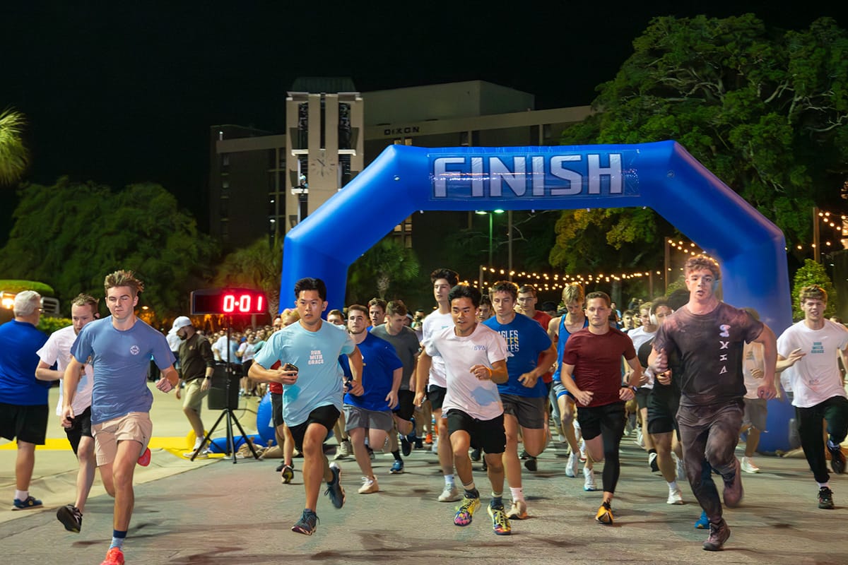 Students running at the start of the race