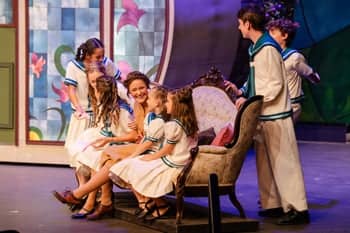 Maria and the von Trapp children singing "Do-Re-Mi."