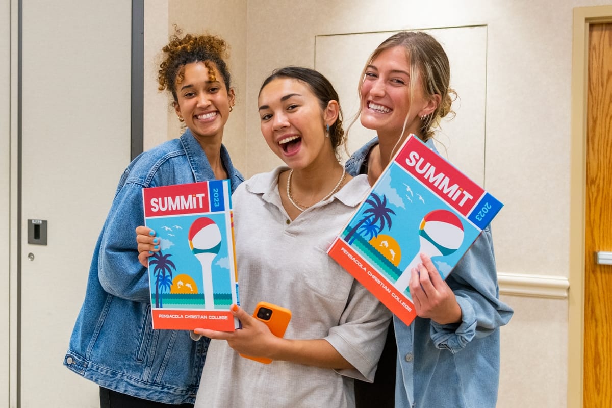 summit-distribution-2 Students pose with the new 2023 Summit Yearbook