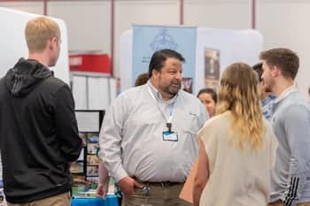 Students talk with a recruiter at PCC's Educator Recruitment event