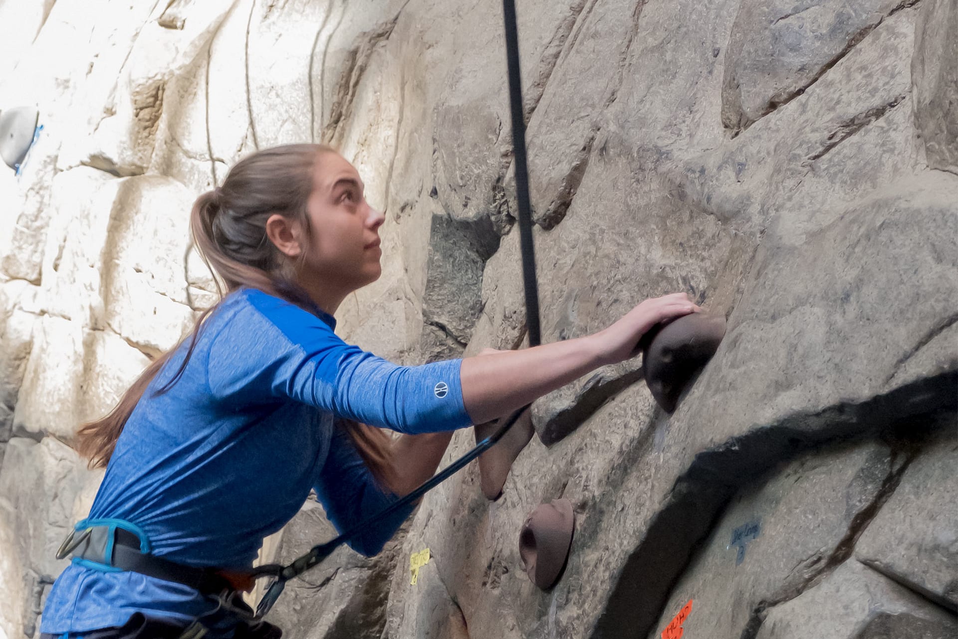 Girl rock climbing.