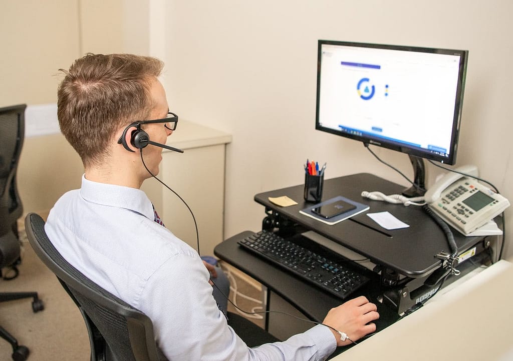 Enrollment advisor at his desk.