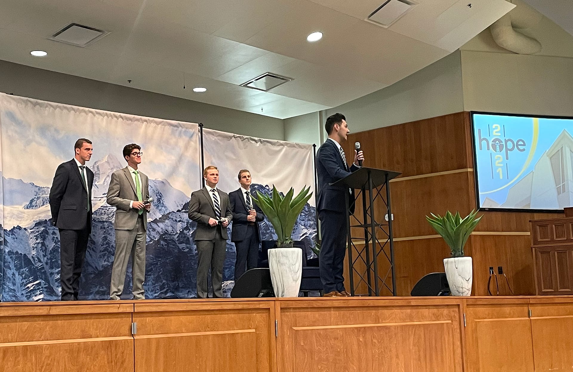 Male Proclaim team singing on a church stage