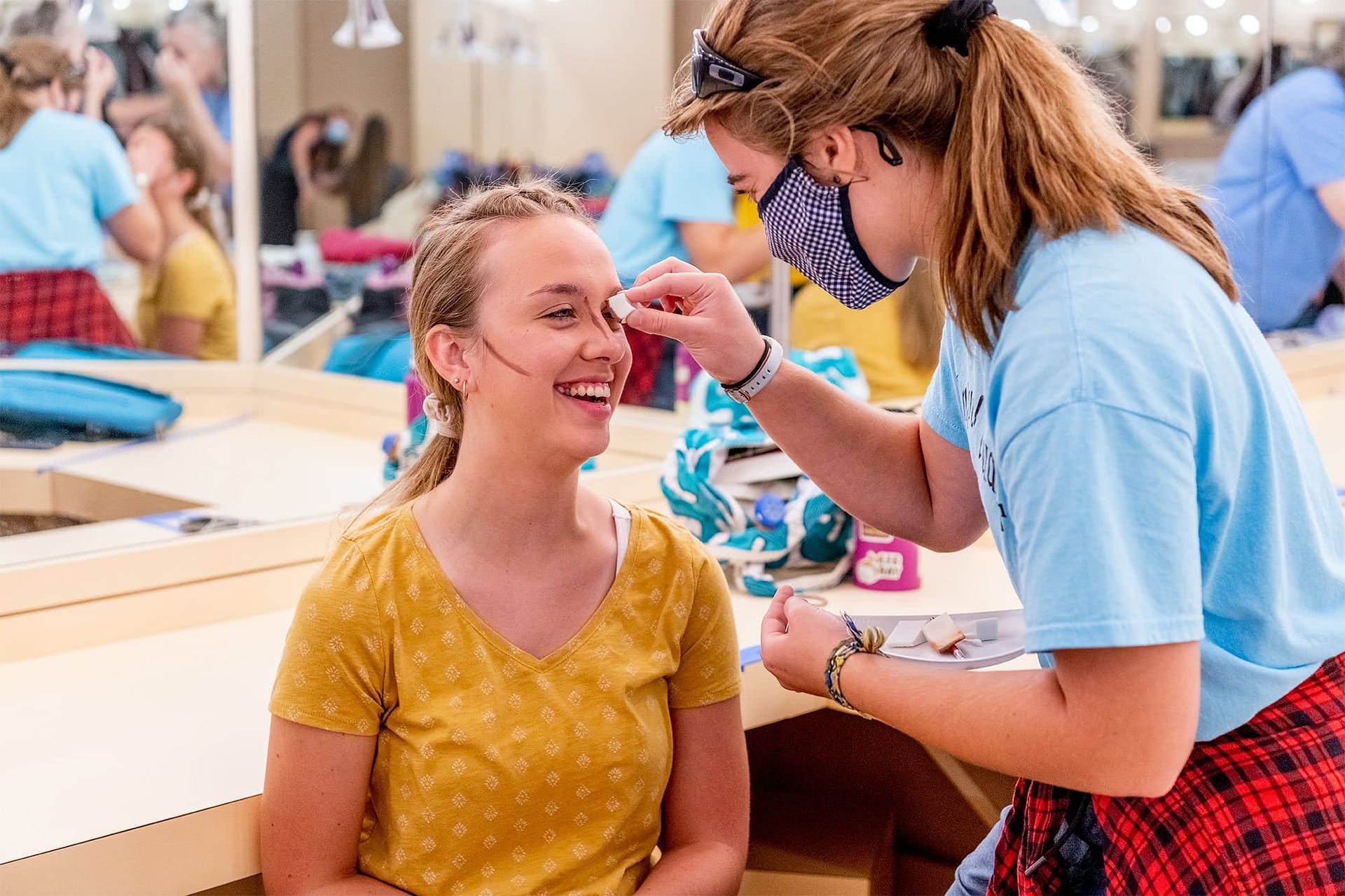 Actors putting on stage makeup