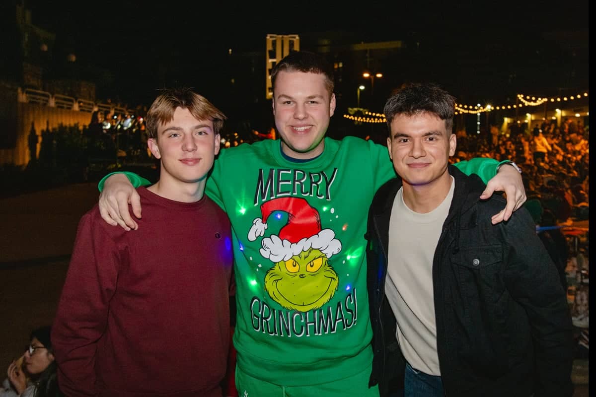 PCC Student guys pose before the Christmas Lights Celebration 2024