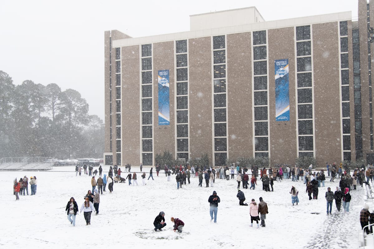 PCC Students enjoy the snow on Eagle Field.