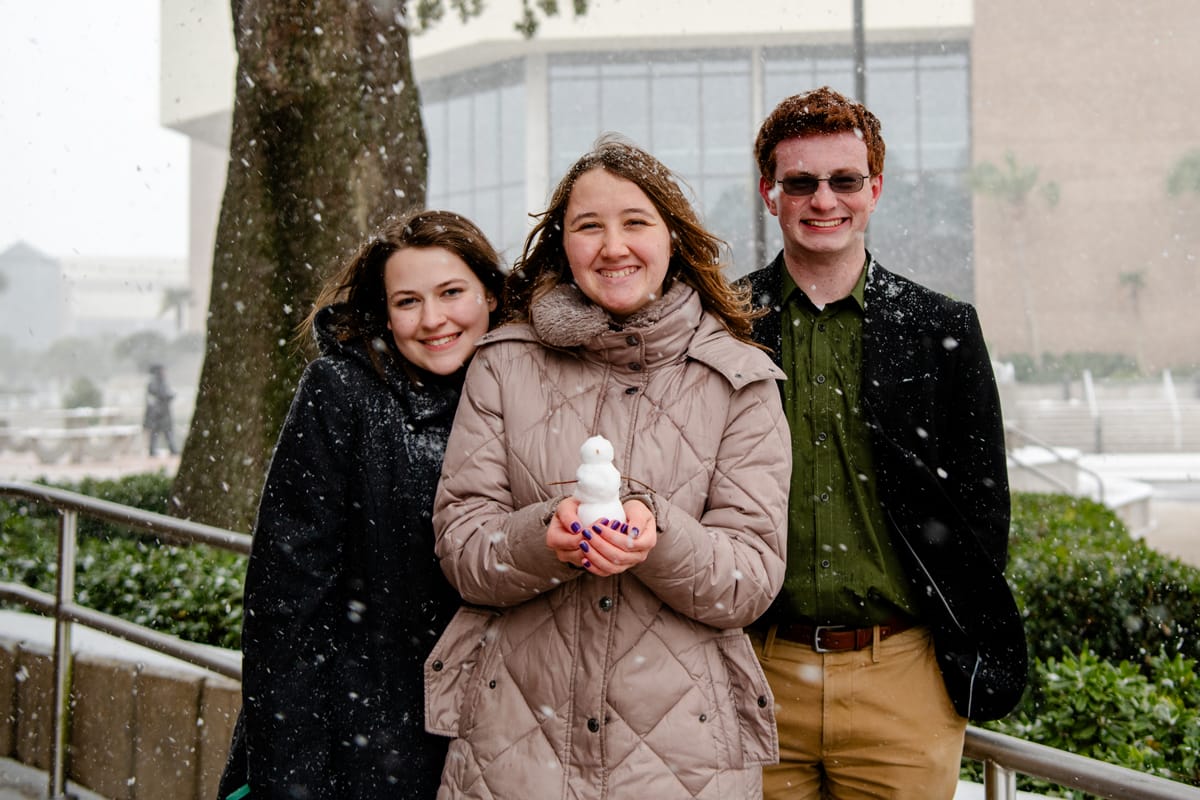 PCC students pose with their mini snowman.