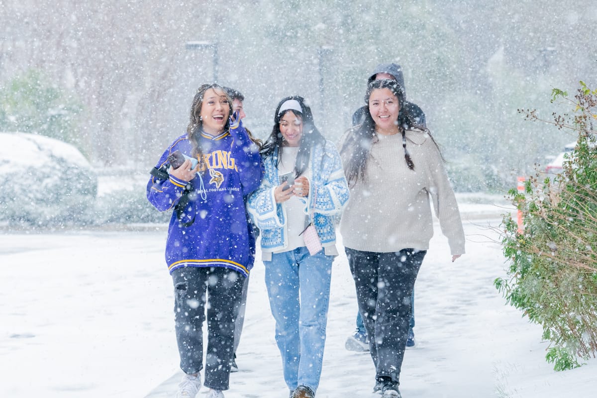 PCC girls enjoy walking around campus in the snow.