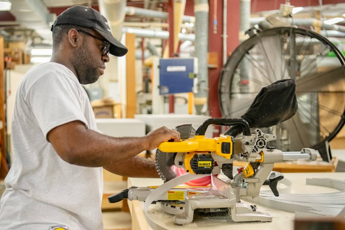 Summer student worker working at the cabinet shop