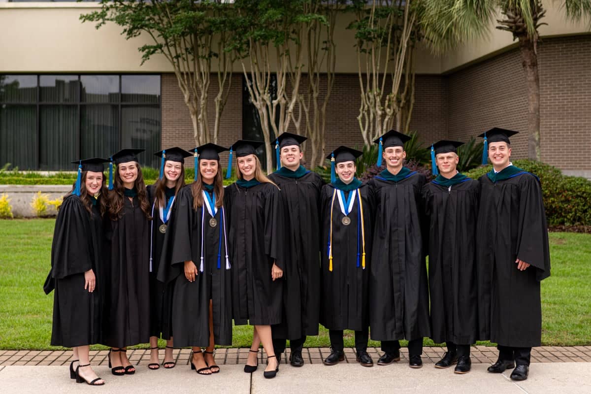 Graduates pose for a photo at the PCC Commencement 2025