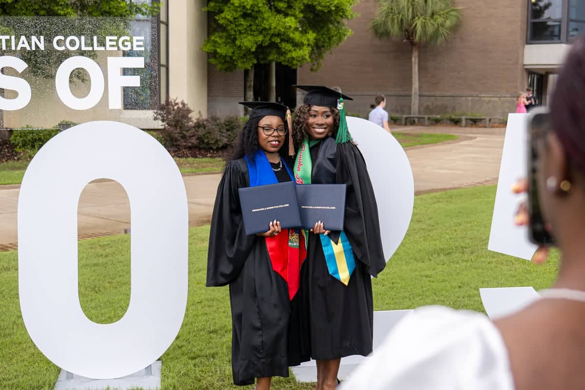 Graduates pose for a photo at the PCC Commencement 2025