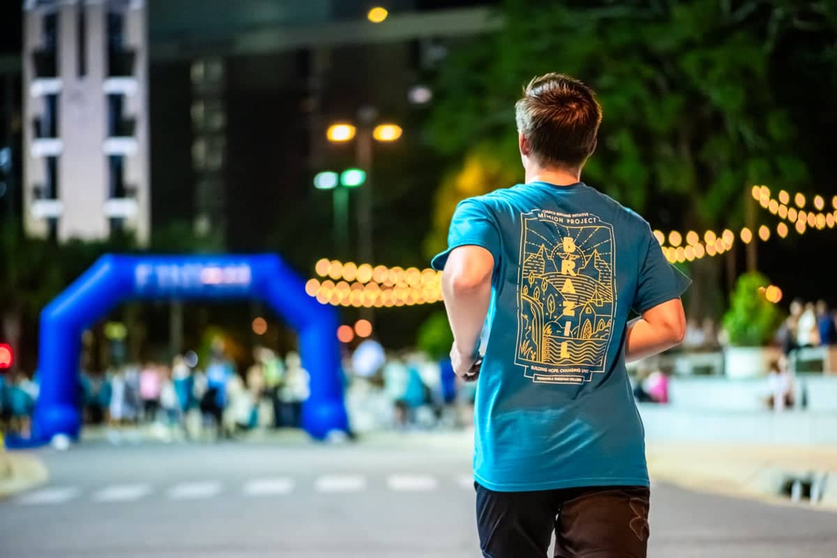 PCC Student runs to the finish line at the 2025 Mission Run